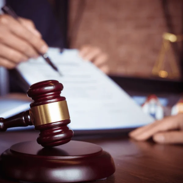 Judge's gavel on desk with legal documents, symbolizing the legal validity of Online Minor Travel Authorizations.